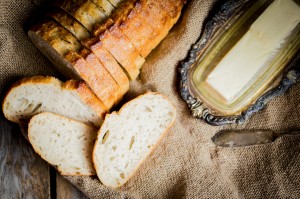 Sliced fresh bread on wooden background,vintage